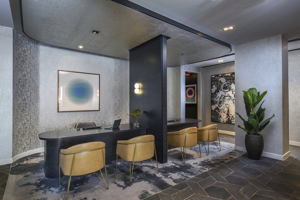 Clubhouse with modern design at Alta 801 Apartments, featuring luxury lounging areas and stylish decor in urban setting