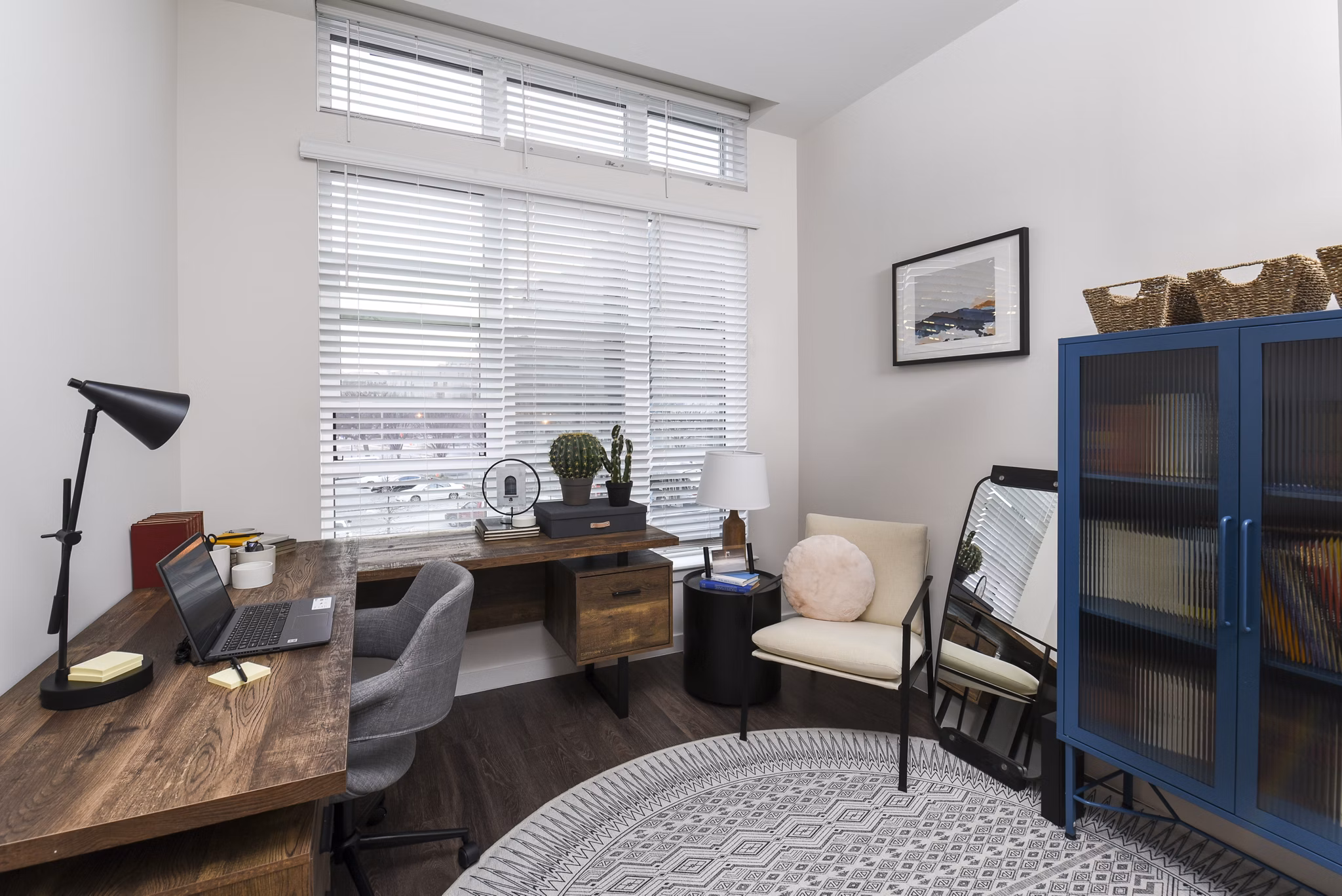 Modern home office with ergonomic chair and built-in desk at Alta 801 Apartments