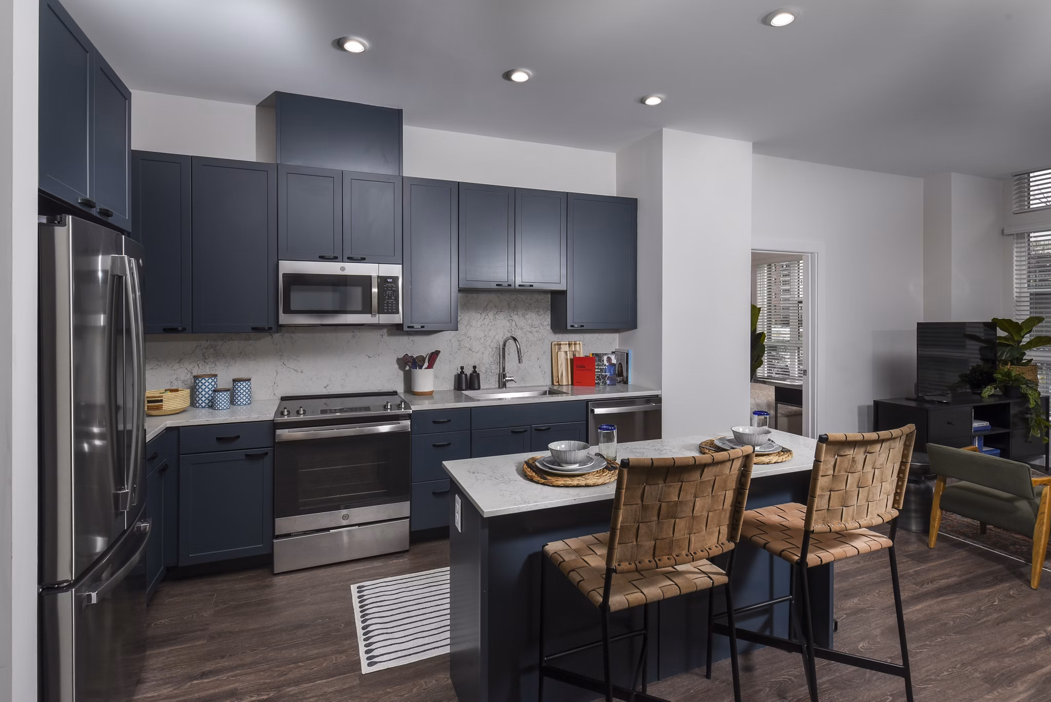 Modern kitchen featuring stainless steel appliances at Alta 801 Apartments