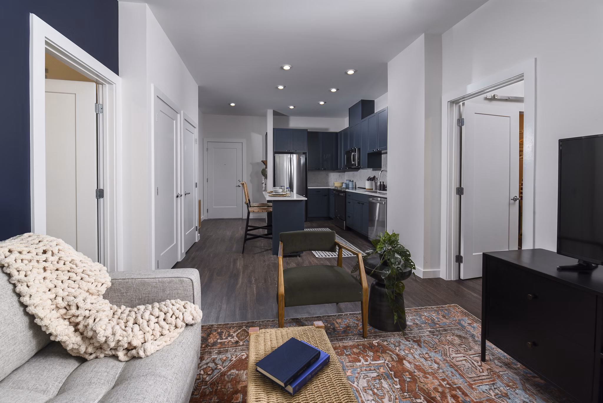 Living room featuring modern decor and cozy seating at Alta 801 Apartments luxury units