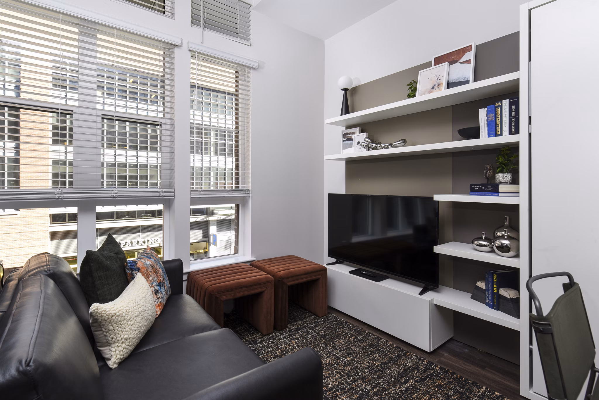 Living room showcasing modern decor and natural light at Alta 801 Apartments