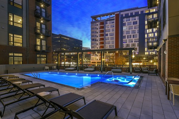Spacious pool area with comfortable lounge chairs at Alta 801 Apartments