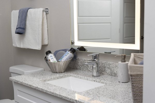 Modern bathroom with sleek fixtures at Alta 99th Ave Apartments