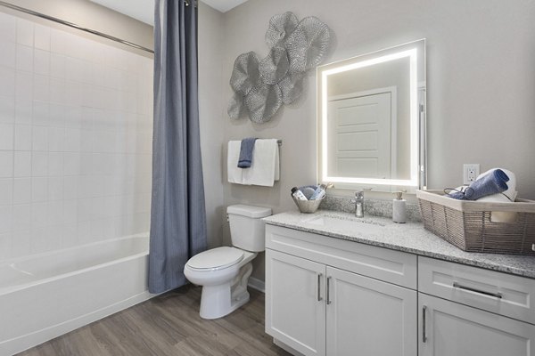 Elegant bathroom featuring marble countertops and modern fixtures at Alta 99th Ave Apartments in Peoria, offering luxury living by Greystar