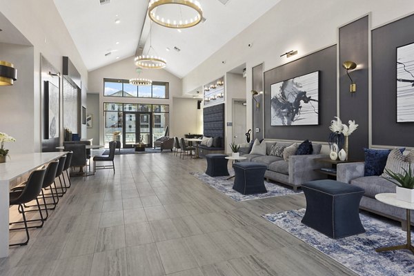 Clubhouse with modern design and cozy seating at Alta 99th Ave Apartments, a Greystar luxury property in the suburban area