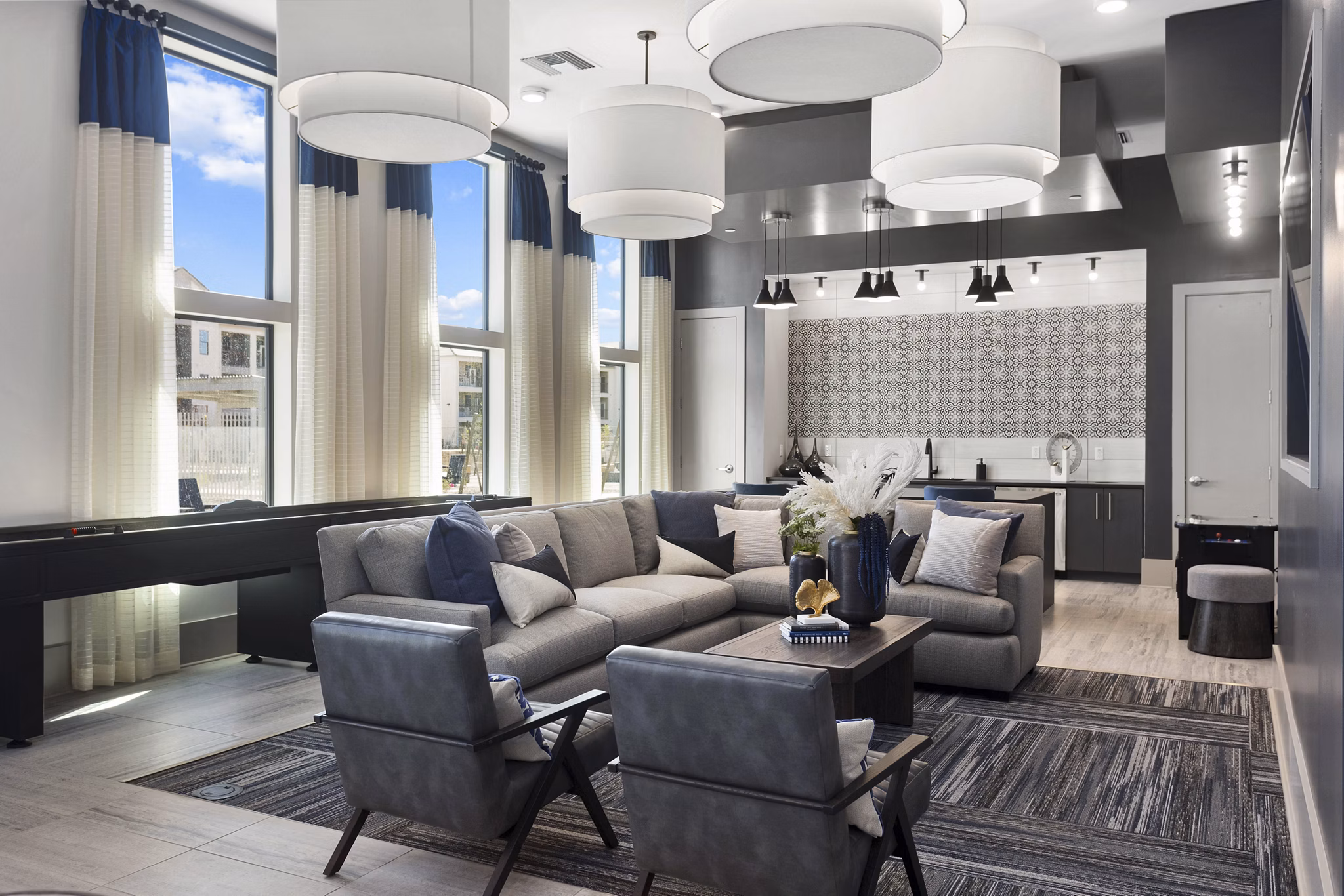 Modern clubhouse with stylish seating and entertainment areas at Alta 99th Ave Apartments