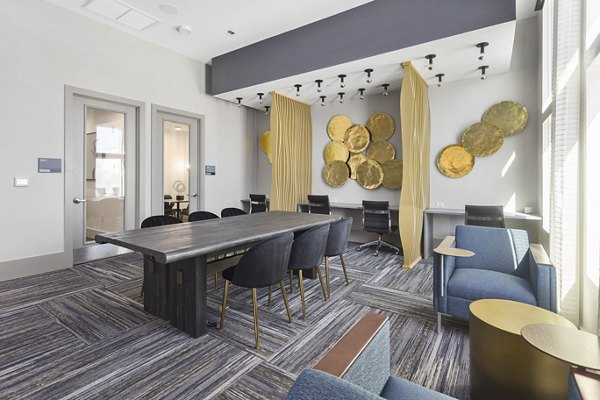 Meeting space with modern furnishings at Alta 99th Ave Apartments, ideal for business gatherings and community events in a luxury setting