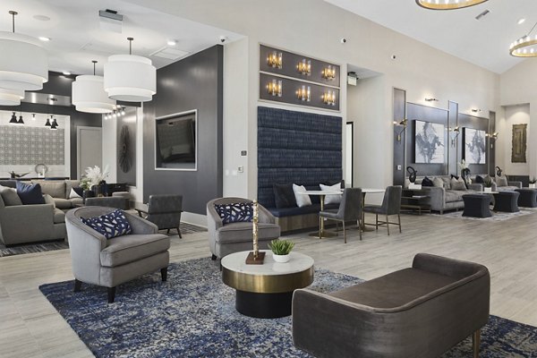 Clubhouse with modern design and cozy seating at Alta 99th Ave Apartments