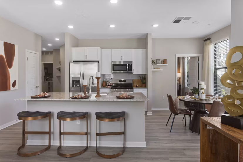 Modern kitchen with stainless steel appliances at Alta 99th Ave Apartments