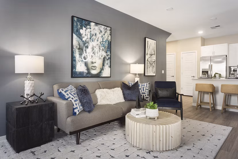 Spacious living room with modern furnishings at Alta 99th Ave Apartments