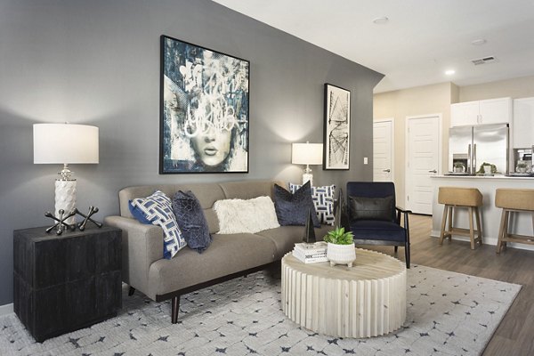 Spacious living room with modern furnishings at Alta 99th Ave Apartments