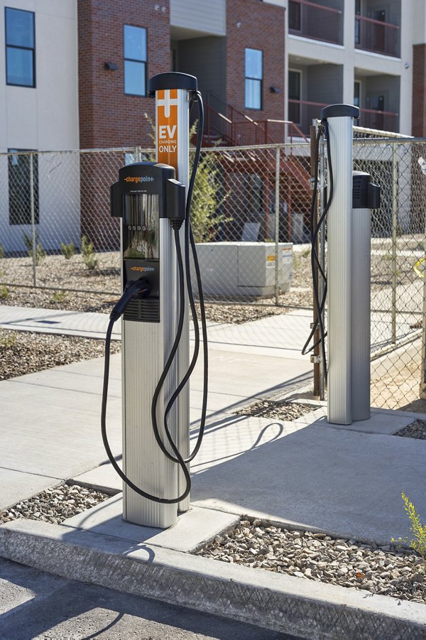 Car charging stations at Alta 99th Ave Apartments offering modern convenience for residents