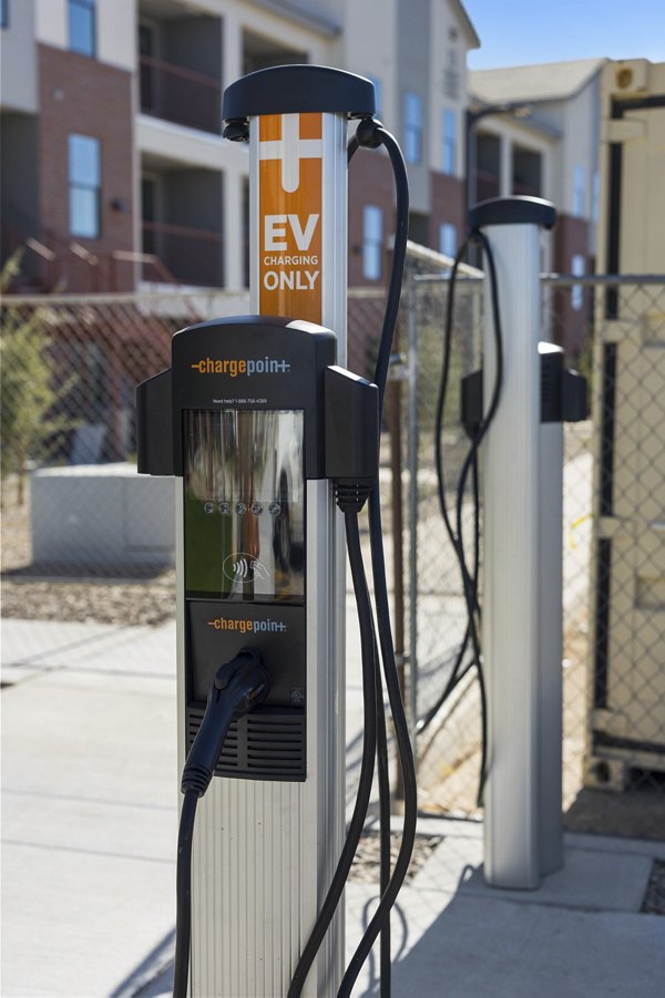 Eco-friendly car charging station at Alta 99th Ave Apartments, a Greystar property focused on sustainable living in Phoenix