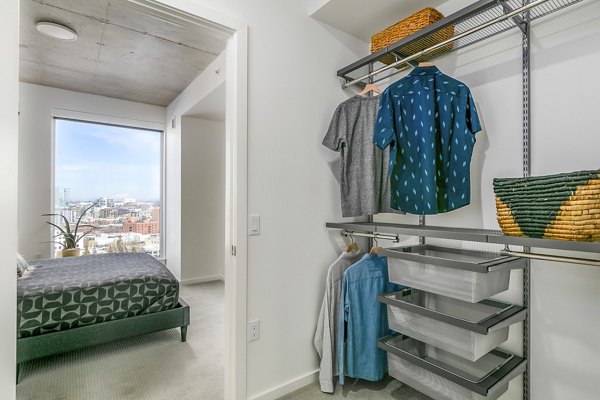 Spacious bedroom closet with customizable shelving in Alta ART Tower Apartments, luxury high-rise living near cultural hotspots