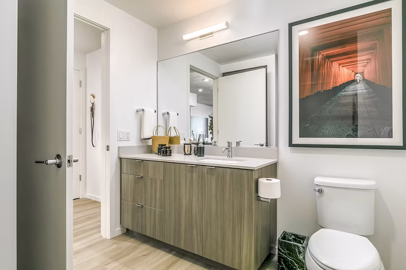 Modern bathroom with white countertops and sleek fixtures in Alta ART Tower Apartments