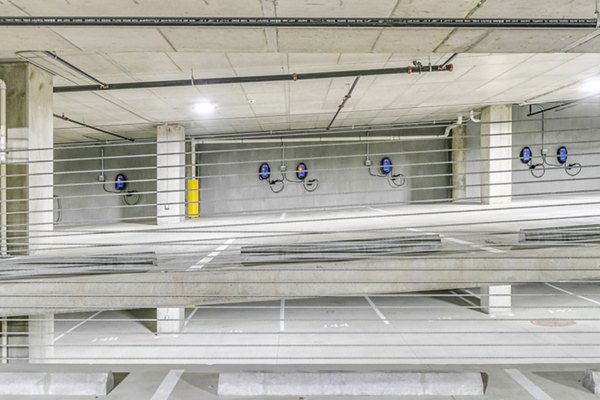 Secure covered parking garage at Alta ART Tower Apartments, a luxury residential building in city center