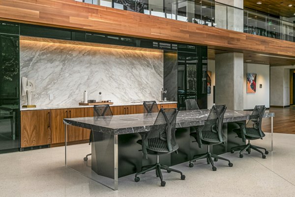 Alta ART Tower Apartments: Stylish clubhouse lobby with modern dÃ©cor and seating options in a vibrant community setting