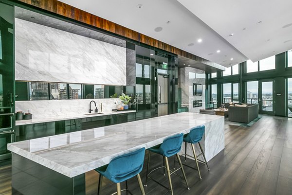 Clubhouse lobby with modern seating and artwork at Alta ART Tower Apartments in Seattle, offering luxury amenities tailored for urban living