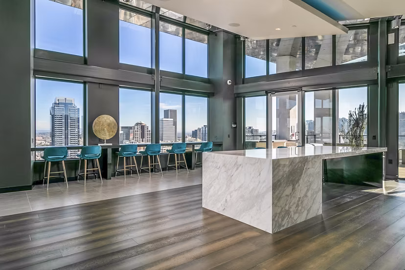 Modern clubhouse lobby with contemporary design at Alta ART Tower Apartments, offering luxury living spaces for residents in a vibrant community