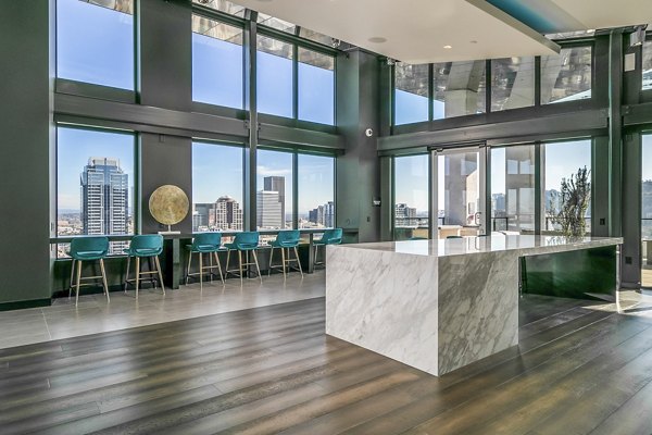 Modern clubhouse lobby with contemporary design at Alta ART Tower Apartments, offering luxury living spaces for residents in a vibrant community
