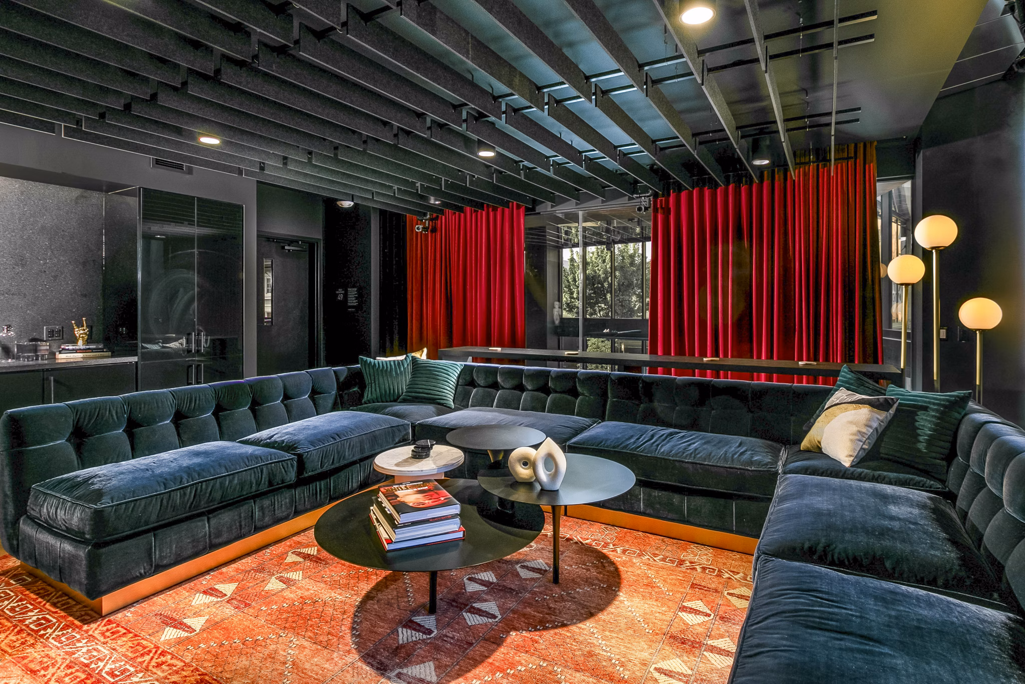 Elegant clubhouse lounge at Alta ART Tower Apartments with modern decor and ample seating