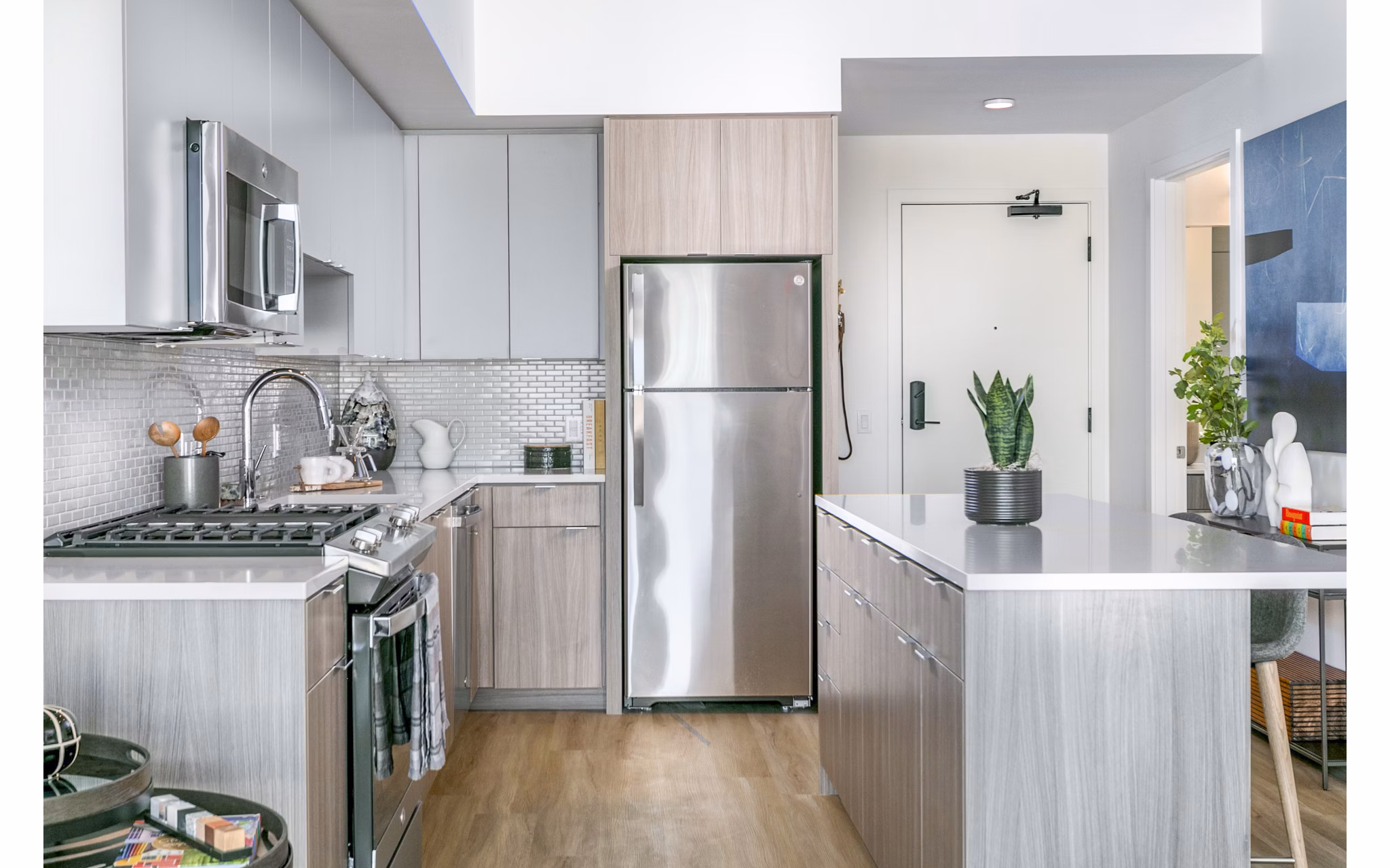 Modern kitchen with stainless steel appliances in Alta ART Tower Apartments, offering luxury living spaces in the heart of the city