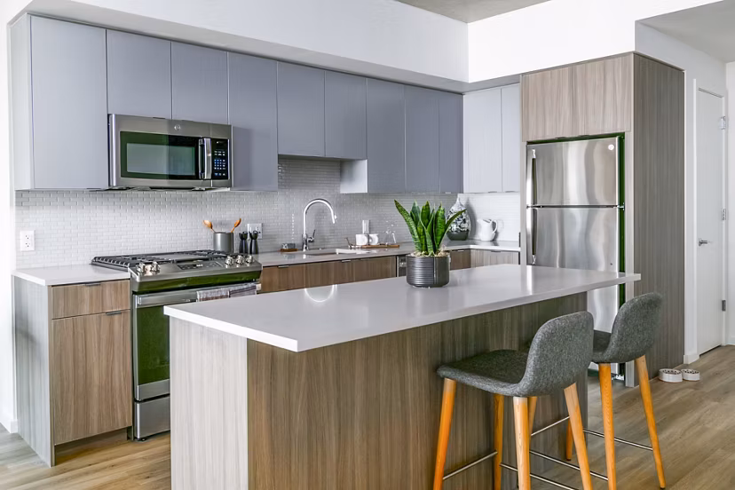 Modern kitchen with stainless steel appliances at Alta ART Tower Apartments