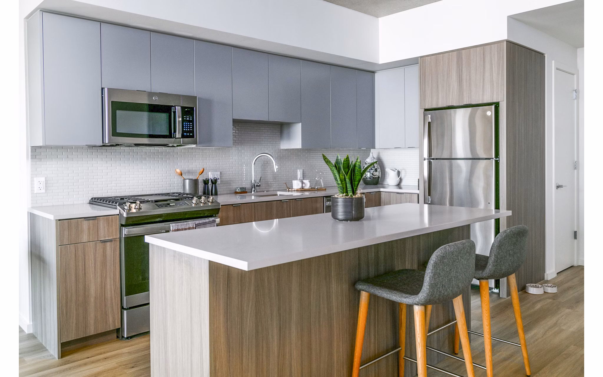 Modern kitchen with stainless steel appliances at Alta ART Tower Apartments