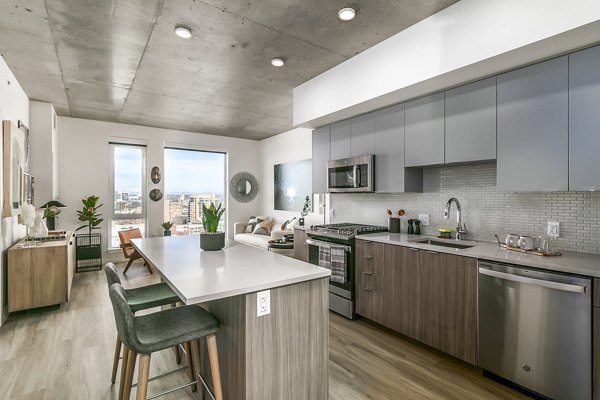 Modern kitchen with stainless steel appliances at Alta ART Tower Apartments