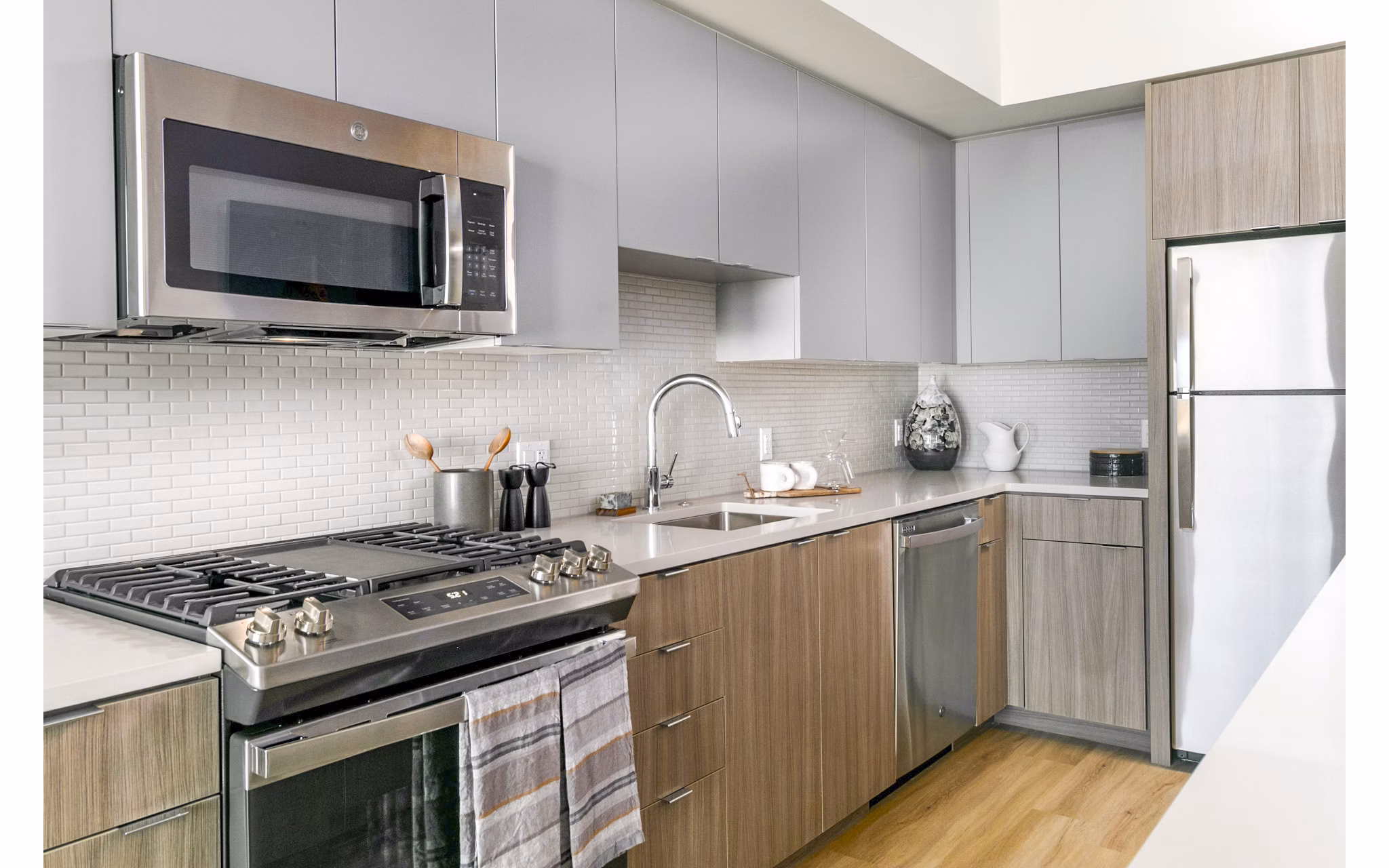 Modern kitchen with sleek appliances at Alta ART Tower Apartments