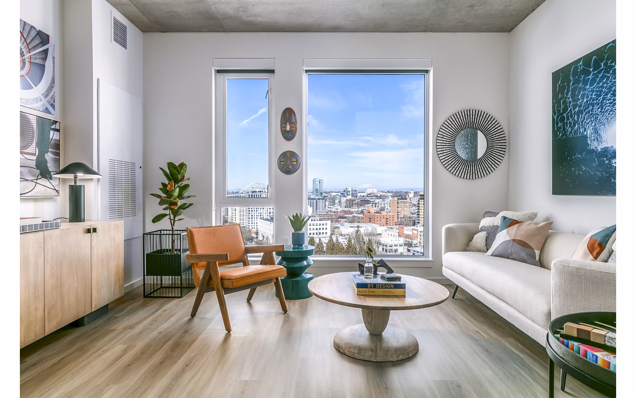Living room with modern decor and large windows at Alta ART Tower luxury apartments