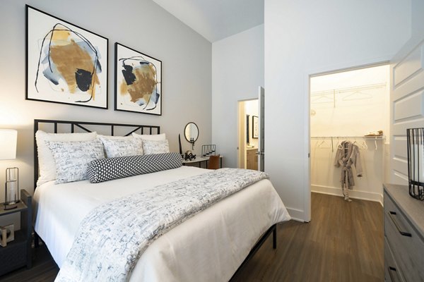 Alta Ashley Park: Elegant bedroom with modern decor and ample natural light