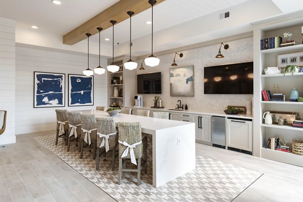 Contemporary clubhouse with sleek design at Alta Ashley Park Apartments, ideal for gatherings and leisure activities