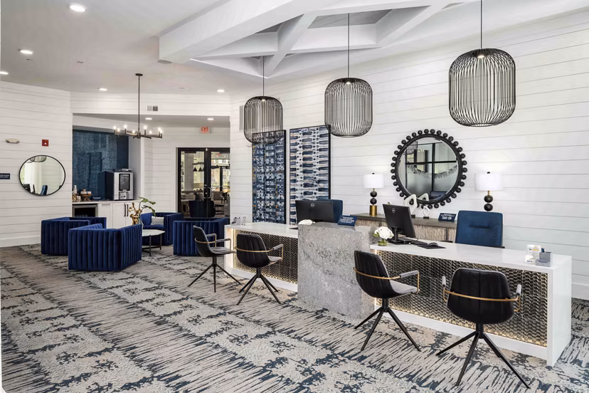 Clubhouse featuring modern design and spacious seating at Alta Ashley Park Apartments