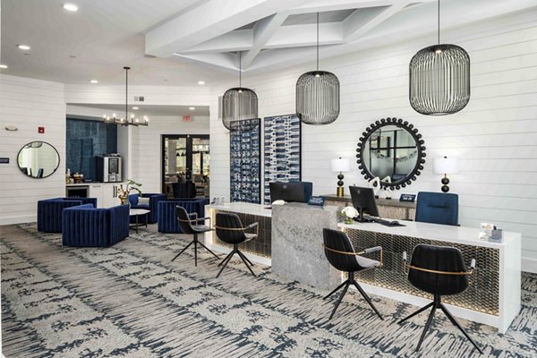 Clubhouse featuring modern design and spacious seating at Alta Ashley Park Apartments