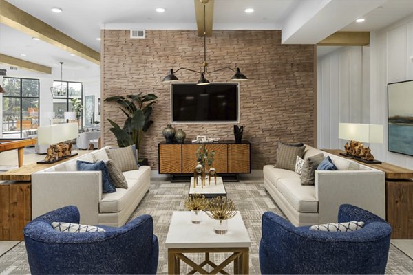 Clubhouse with modern lounge and fitness center at Alta Ashley Park Apartments, a premier community offering luxury living experiences