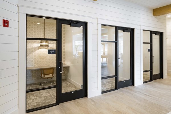 Clubhouse featuring modern design and lounge seating at Alta Ashley Park Apartments