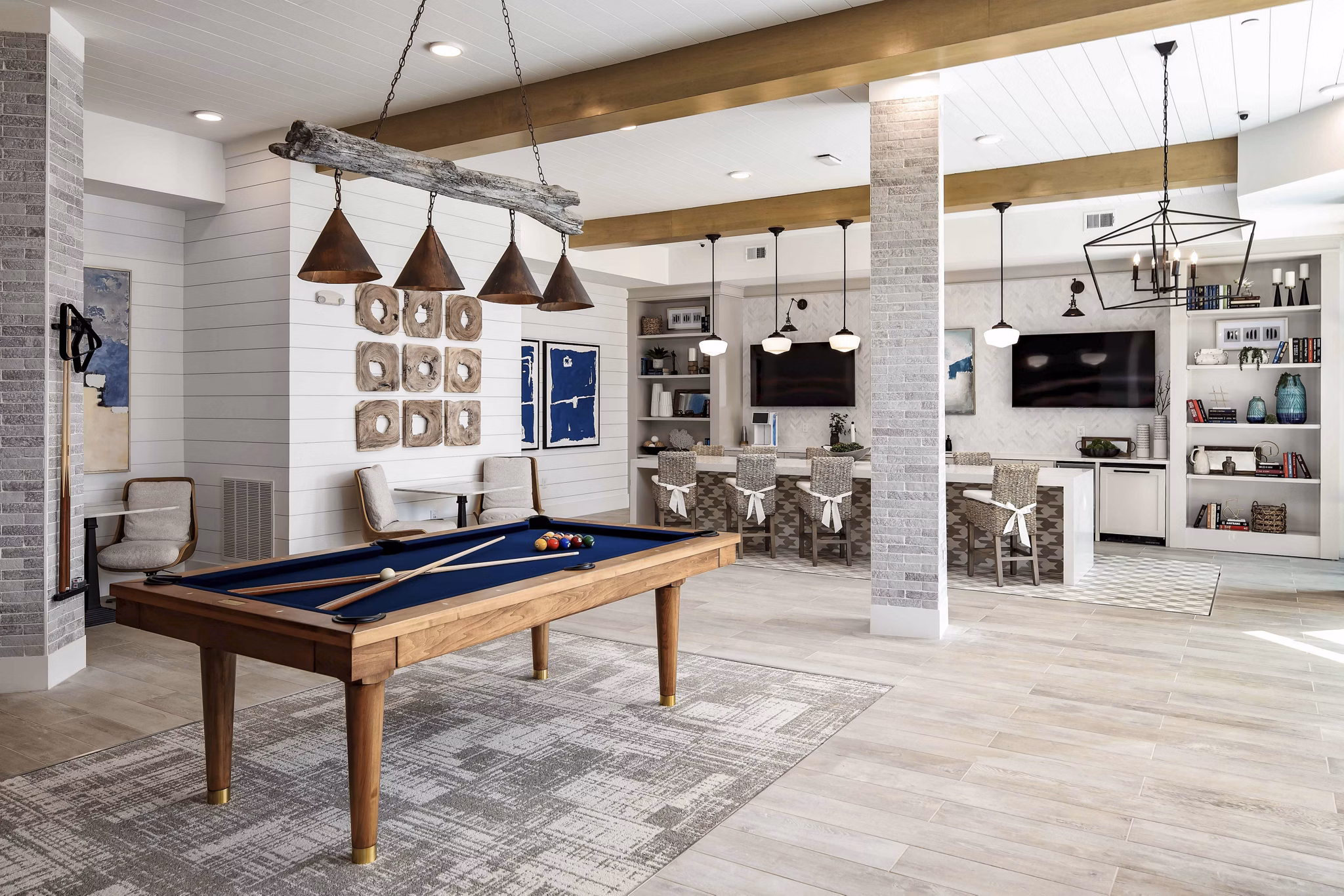 Clubhouse at Alta Ashley Park: Stylish modern space with comfortable seating and game areas in a vibrant apartment community