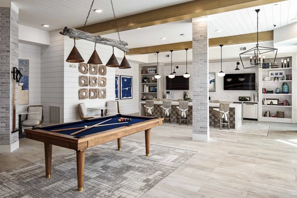 Clubhouse at Alta Ashley Park: Stylish modern space with comfortable seating and game areas in a vibrant apartment community