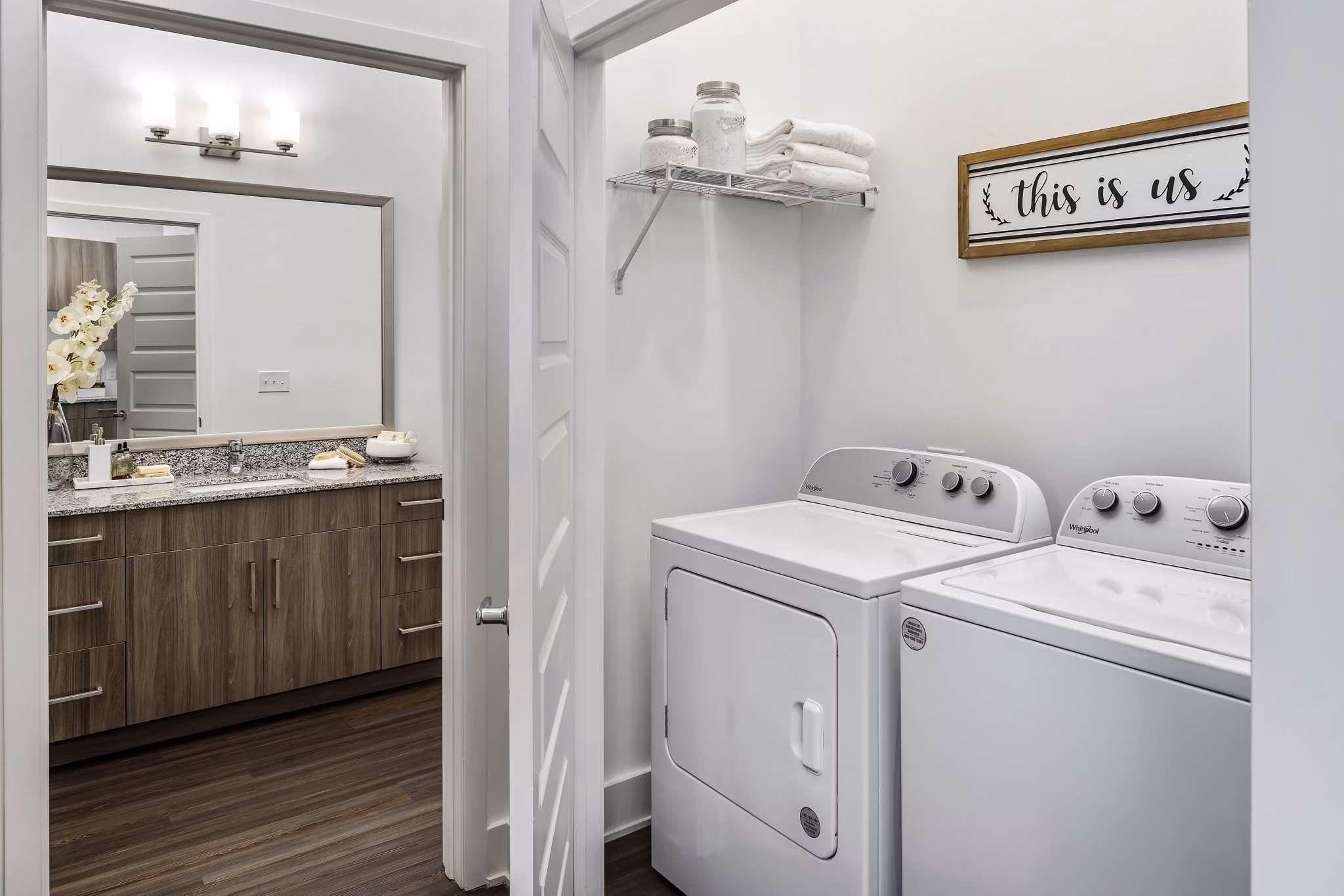 Laundry room featuring modern appliances at Alta Ashley Park Apartments