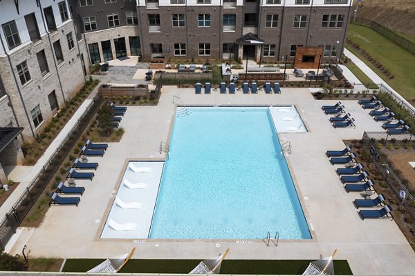 pool with lounging area at Alta Ashley Park Apartments