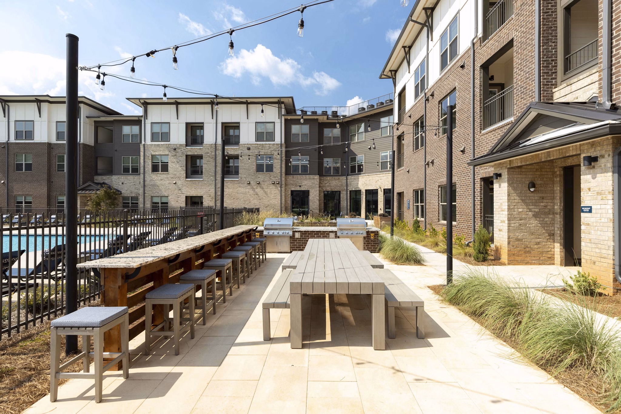 Recreation area with stylish seating and gaming zone at Alta Ashley Park Apartments