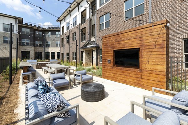 Recreation area featuring modern seating and game tables at Alta Ashley Park Apartments