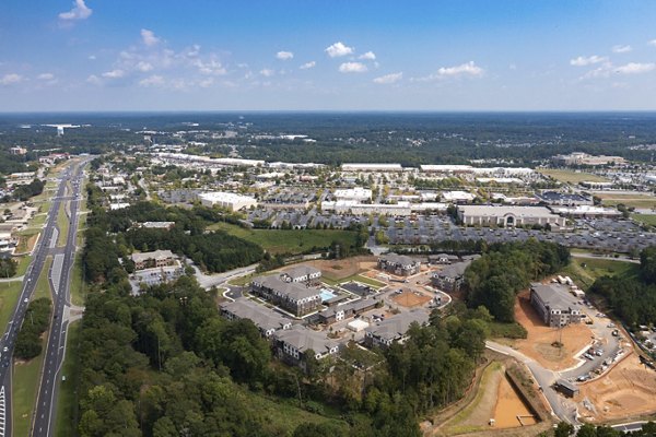 Alta Ashley Park: Lush courtyard view with seating areas at luxury apartments in vibrant Charlotte