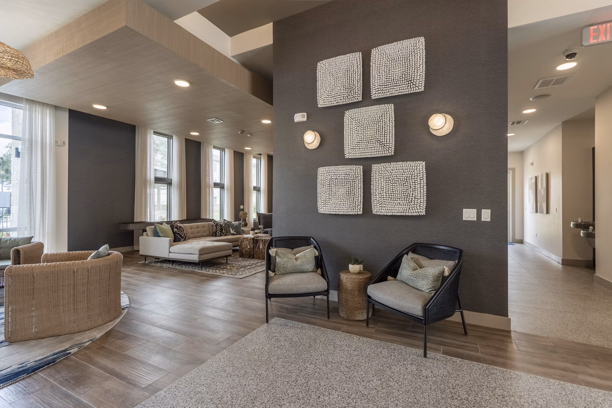 Clubhouse featuring modern design and cozy seating at Alta Berry Creek Apartments