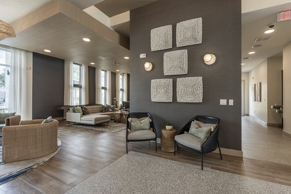 Clubhouse featuring modern design and cozy seating at Alta Berry Creek Apartments