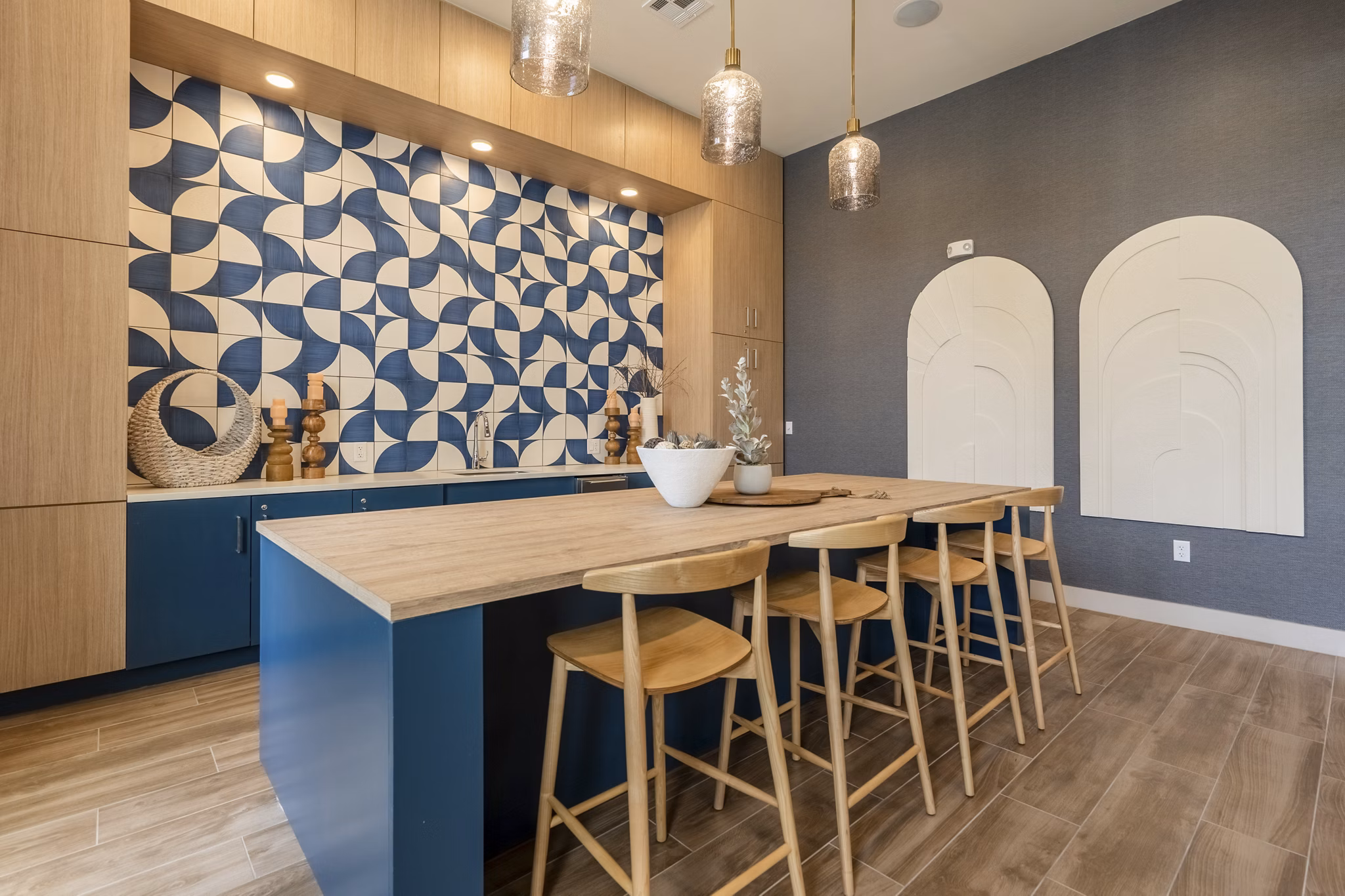 Stylish clubhouse with modern decor at Alta Berry Creek Apartments, featuring cozy seating areas and vibrant artwork