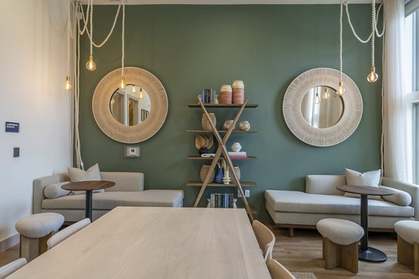 Clubhouse featuring modern seating and entertainment options at Alta Berry Creek Apartments, perfect for luxury living