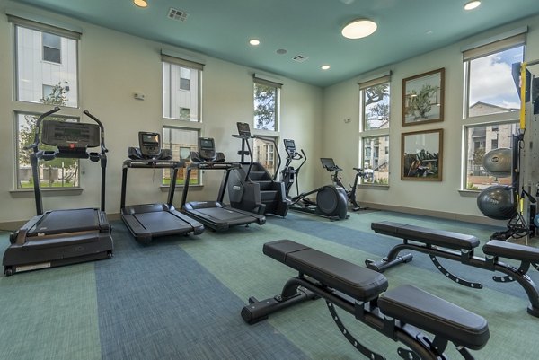Modern fitness center with state-of-the-art equipment at Alta Berry Creek luxury apartments
