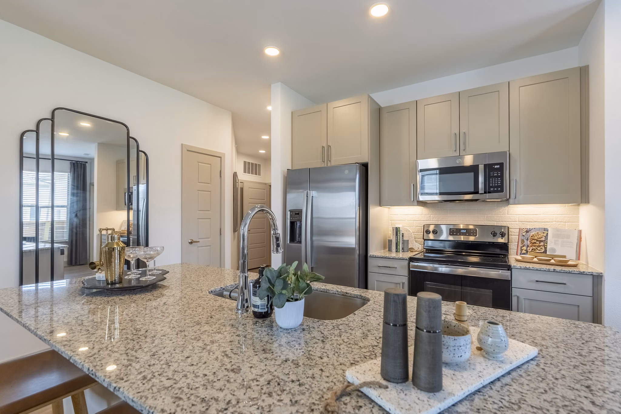 Modern kitchen featuring stainless steel appliances at Alta Berry Creek Apartments